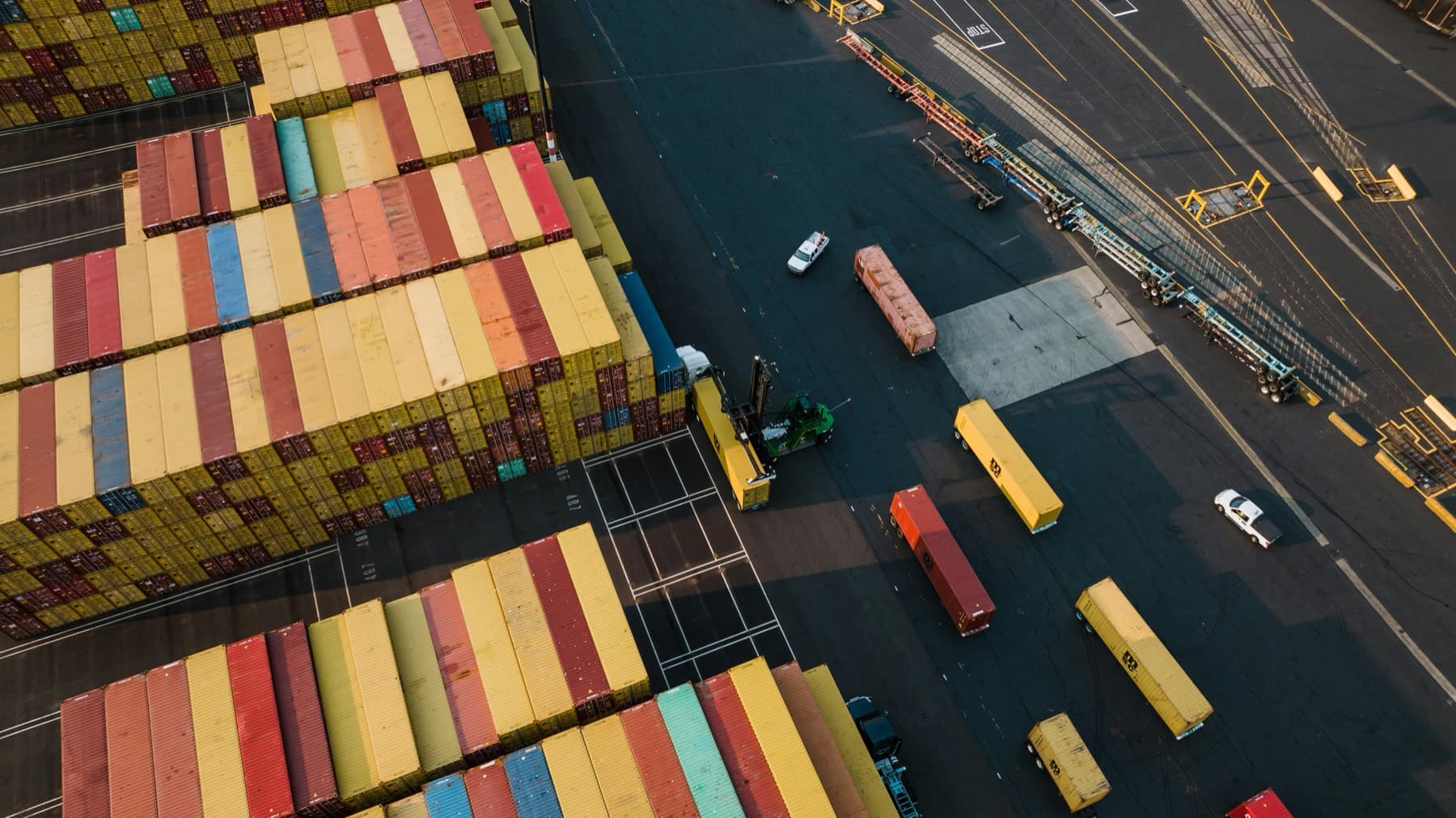 Aerial view of containers and trucks at port